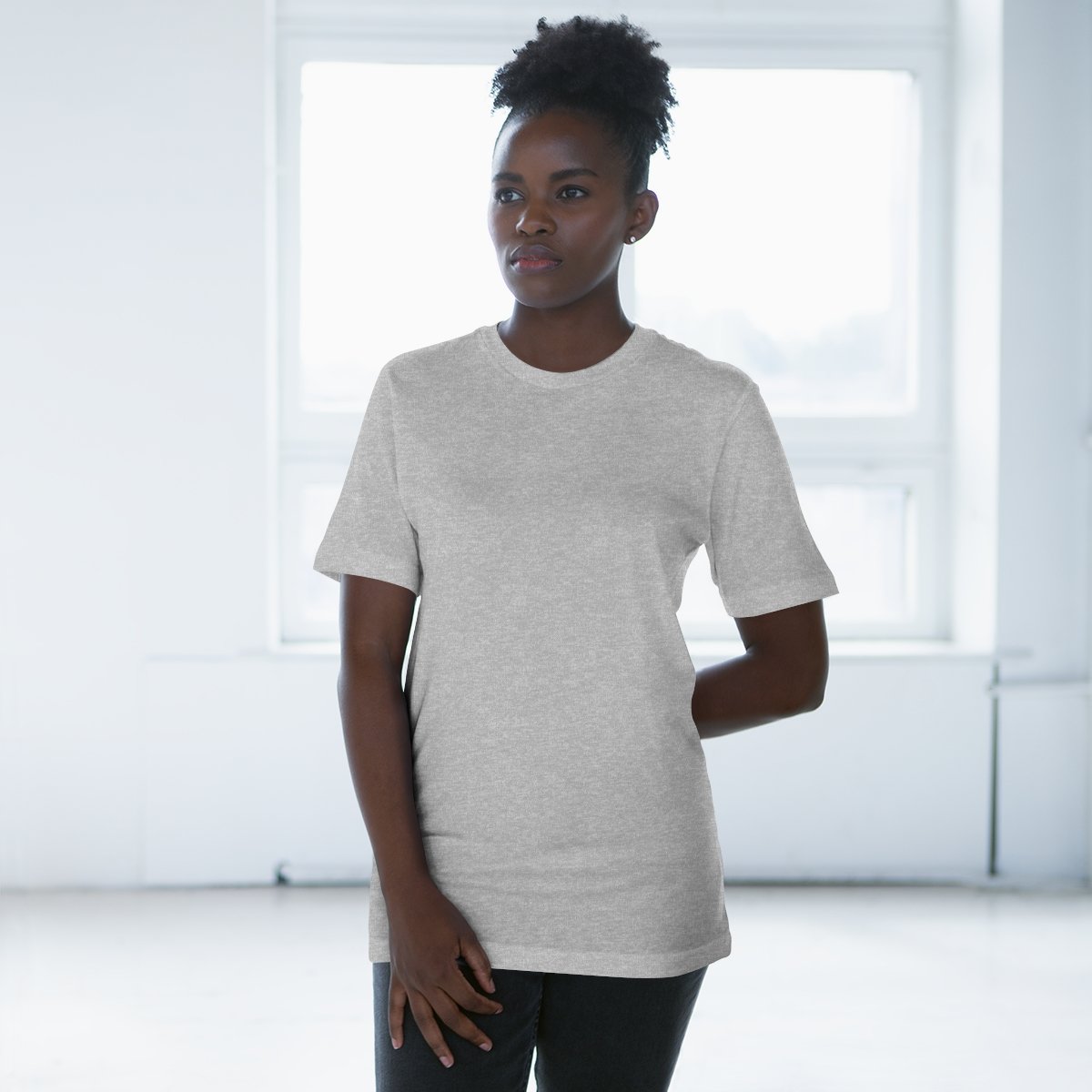 Confident woman showcasing a white Eternal Zones shirt